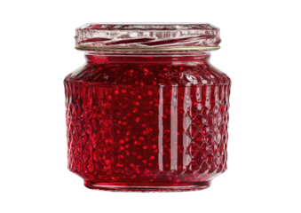 A small glass jar filled with vibrant red berry preserves, seeds visible