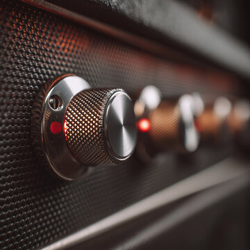 electric guitar amplifier knobs close-up, realistic metal texture, warm backlight

