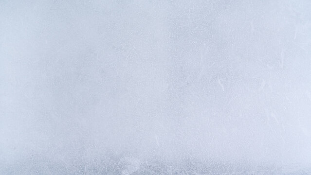 Frozen ice texture frosty surface winter background cold and smooth abstract pattern pale blue color natural chill seasonal clean and fresh