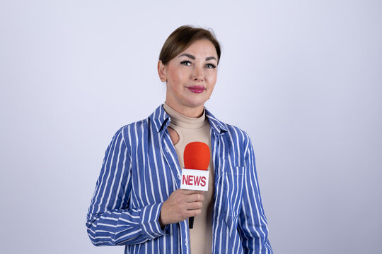 The reporter is presenting the news with a microphone - Powered by Adobe