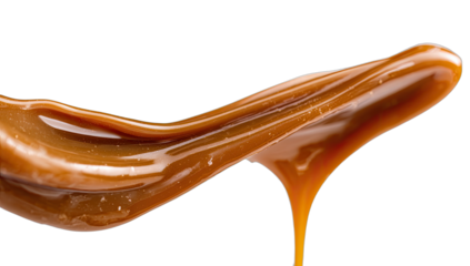 Thick, glossy liquid sweetener swirls and drips against a dark background