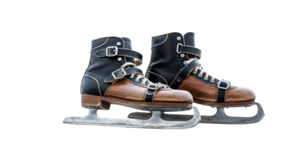 A pair of old vintage ice skates made of brown and black leather, covered in frost and snow, featuring a classic design with buckles, laces, and worn metal blades
