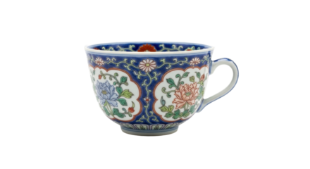 A beautiful antique porcelain teacup decorated with an intricate, hand-painted floral pattern featuring blue and pink peonies with green leaves and a decorative border