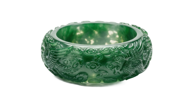 An ornate, wide green jadeite bangle intricately carved with a traditional mythical dragon motif, showcasing exquisite craftsmanship and the beautiful translucent quality of the gemstone