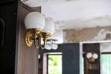 Abandoned lakeside holiday resort with deserted wooden cabins, overgrown vegetation, and decaying buildings reclaimed by nature
