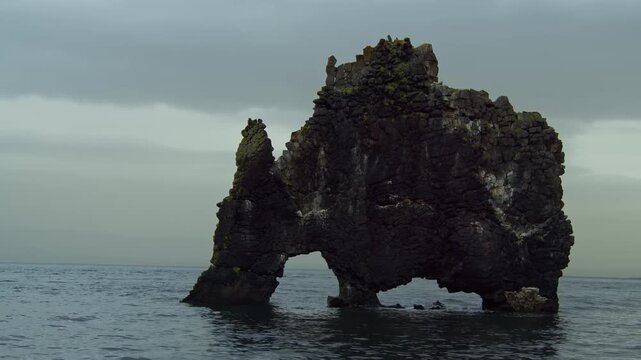 An aerial or wide shot of Hv&iacute;tserkur, a unique basalt rock stack off the shore of the Vatnsnes peninsula in northwest Iceland.