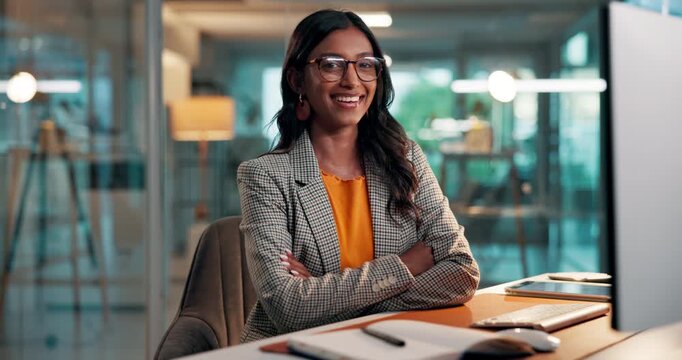 Face, night and happy woman with arms crossed, computer and financial advisor with glasses. Evening, person and investor in workplace, pc and smile with confidence, career ambition and eyewear