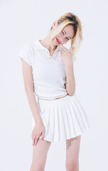 Asian confident attractive beautiful young woman blonde hair tied stand wearing white shirt top mini skirt sport background studio, portrait lifestyle fashion outfit trendy style pose look at camera.