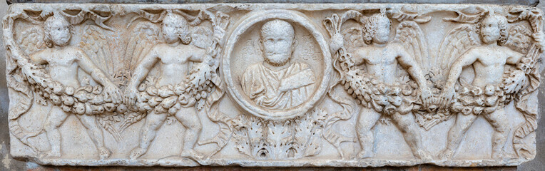 SALERNO, ITALY - OCTOBER 6, 2025: The relief on the ancient roman sarcophagus (reused in medieval)  from atrium of Duomo