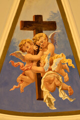 Obraz premium PRAIANO, ITALY - OCTOBER 6, 2025: The fresco of angels with the cross in the side cupola of church Chiesa di san Gennaro by unknown artist of 20. cent. 