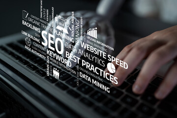 A detailed view of a hand typing on a laptop keyboard surrounded by keywords related to digital marketing and search engine optimization, emphasizing analytics and best practices. Tessel