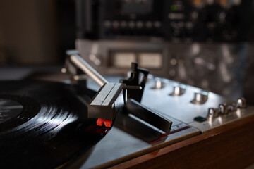 Close up on a vinyl record playing on a turntable