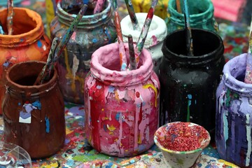 Ateliet bottler with paint and brushes