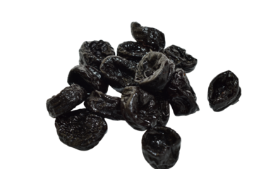 Dried plum fruits called prunes lie in a pile on a PNG background.