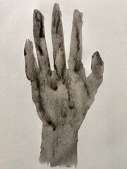 Ink painting of a human hand in sumi-e style with dripping brush strokes on washi paper.