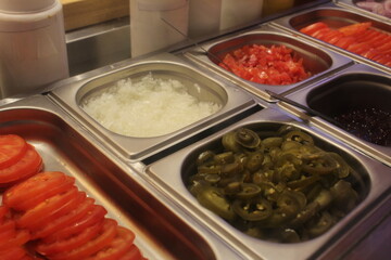 Chopped vegetables in a salad bar. Close-up. Fast food