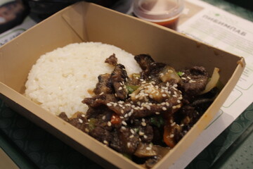 Korean Food Rice with Meat and Water Rolls in a Disposable Container