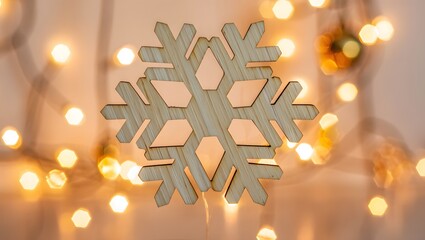 Glittering snowflake ornament with soft bokeh lights background