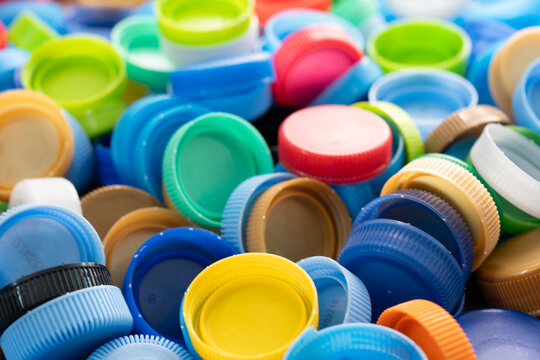 Close up plastic bottles caps for recycling to conserve the environment, recycling, reuse, garbage disposal, save the world concept.