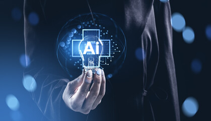 Futuristic concept of AI innovation with holographic lightbulb held by hand on glowing tech background illustrating artificial intelligence technology..