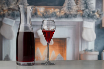 Glass of red wine on Christmas background medium shot selective focus