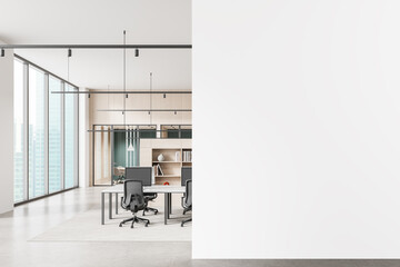 Modern office interior with blank white wall for poster mockup or advertising presentation template in clean minimal workspace environment. 3D Rendering