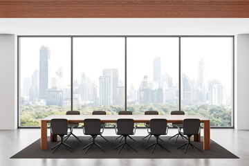 Modern conference room interior with wooden table, minimalist chairs and large panoramic windows overlooking a city skyline and green parkland view. 3D Rendering