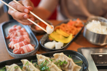 White daikon, banchan, and other Korean appetizers in a restaurant. Fermented food, traditional Asian meals.