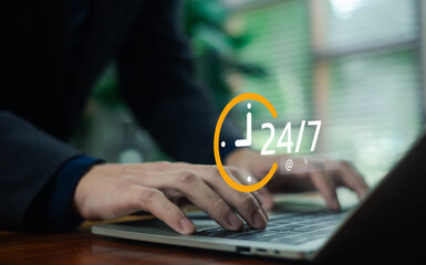 business professional typing on a laptop with a 24 service icon overlay, symbolizing continuous support, online availability, customer service accessibility, and nonstop digital operation in a modern.