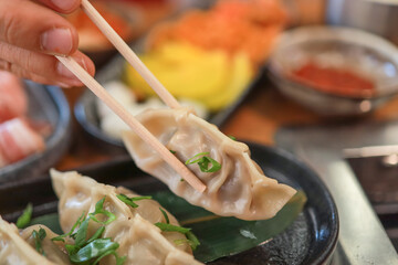 Traditional Korean steamed dumplings in a Korean restaurant. Global food culture.