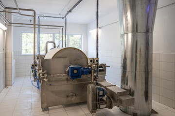 A large industrial rotary drum vacuum filter in a potato starch factory. Wet starch pulp is fed...
