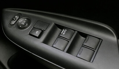 Electric power window control panel. Modern car interior