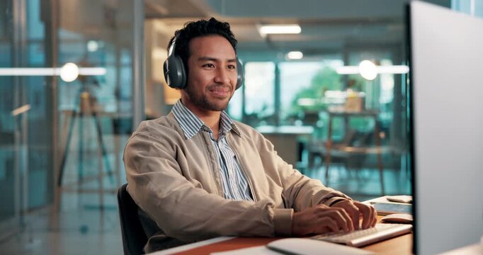 Man, headphones and playlist in office with computer for financial report, budget proposal and music. Person, smile and audio in workplace with technology for finance plan, streaming song or album