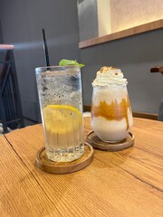 Glass of refreshing lemon and crunchy biscuits drink