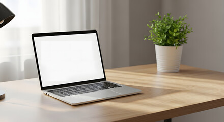 Fototapeta premium Laptop and Plant in Bright Room: The modern workspace presents a clean, minimalist aesthetic, featuring a laptop with a blank screen on a wooden desk alongside a potted plant.