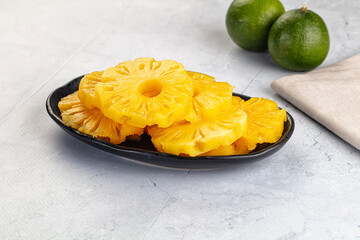 Sweet canned pineapple slices in syrope