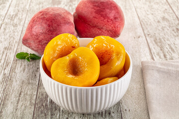 Sweet ripe yellow canned peaches