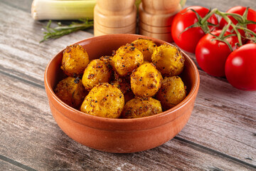 Baked small baby potato with herbs