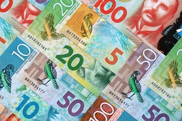 New Zealand dollar money bills in big amount on table close up. Rich life concept in New Zealand. Business and economy