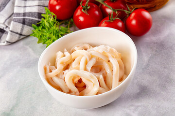 Canned marinated squid rings heap