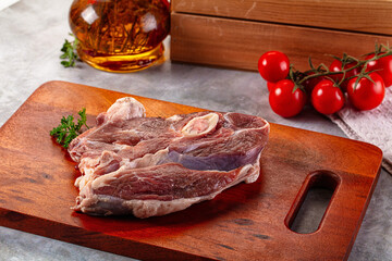 Raw lamb steak with bone