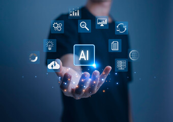 An AI digital interface hovering above a persons hand, representing data analytics, cloud computing automation and intelligent technology driving modern business innovation and digital transformation.
