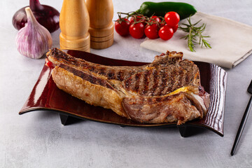 Grilled ribeye beef steak with bone