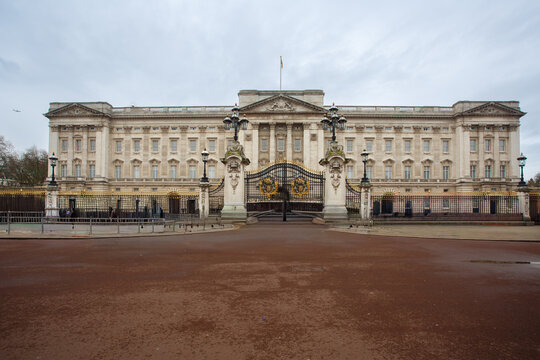 The facade and intricate gate of the elegant Buckingham Palace,  St James, London, England