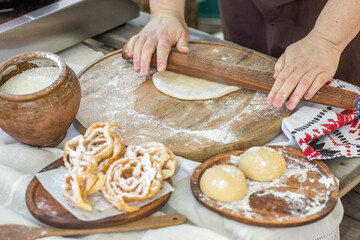 Artisan chef making authentic homemade biscuits following old Moldovan recipes. Heritage baking scene. cozy rural kitchen