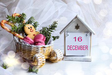 December 16 Calendar: The number 16 and the month "December" in English on a decorative calendar next to a sleigh