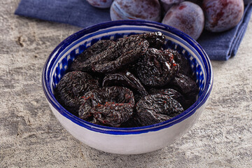 Black dry sweet prunes heap