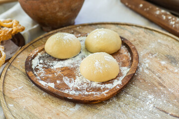 Artisan chef making authentic homemade biscuits following old Moldovan recipes. Heritage baking scene. cozy rural kitchen