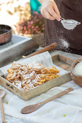 Artisan chef making authentic homemade biscuits following old Moldovan recipes. Heritage baking scene. cozy rural kitchen