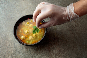 Classic meatball soup with potatoes,  carrot and greens.